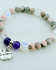 Stones bracelet with 'Grandma' charm on a white background