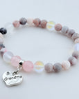 Beaded bracelet with a 'Grandma' charm on a light background
