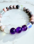 Multicolored beaded bracelet on a marble surface