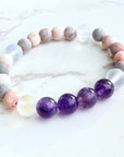 Multicolored beaded bracelet on a marble surface
