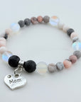 Beaded bracelet with 'Mom' charm on a light background