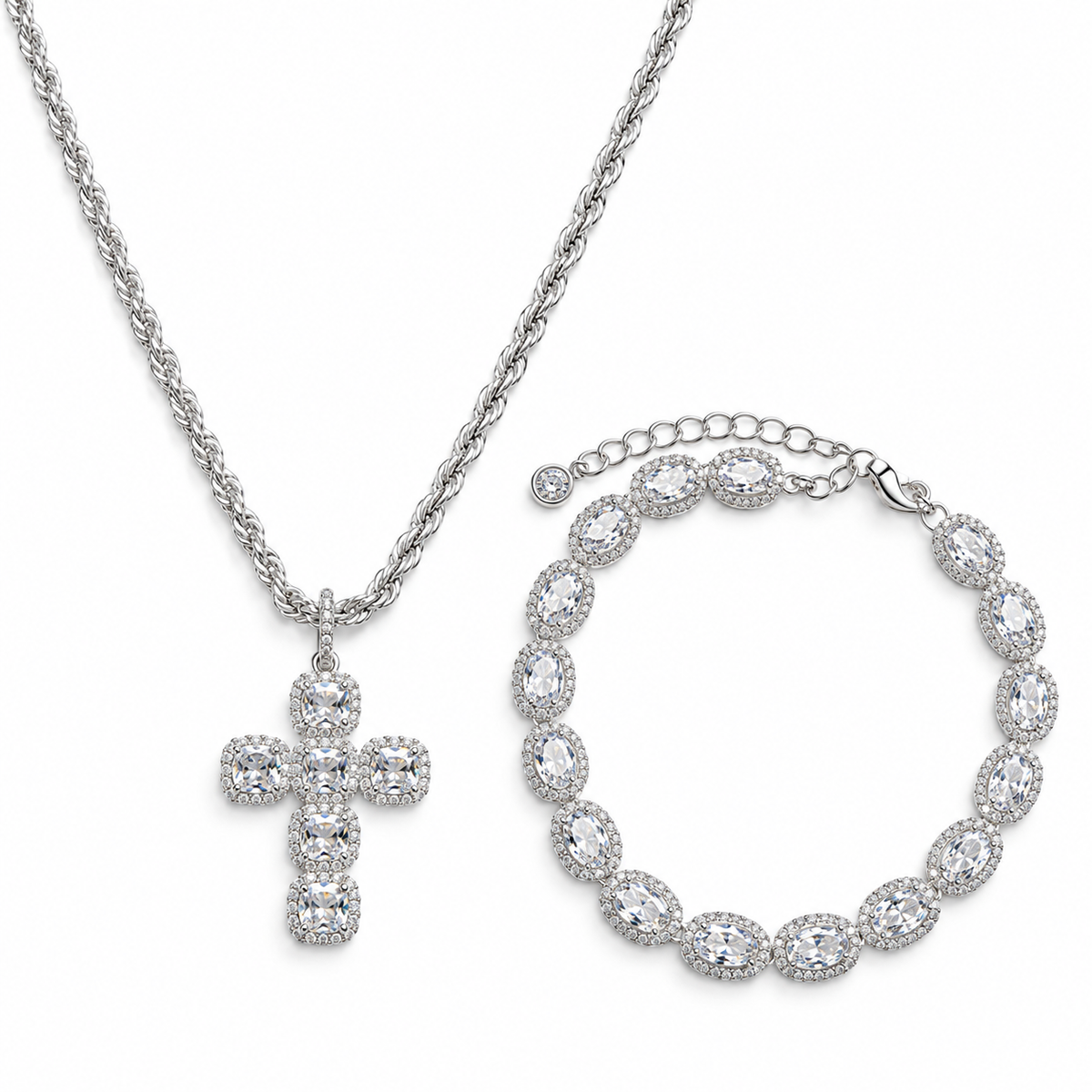 Silver-tone cross pendant necklace and matching bracelet set, both adorned with clear pavé stones, shown on a plain white background.