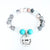 Beaded bracelet with turquoise charm and 'Mom always in my heart' tag on a white background