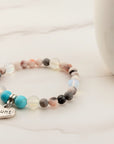 Beaded bracelet with a heart-shaped 'Aunt' charm on a light background