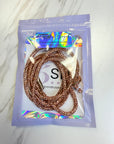 Champagnge hoodie cord in a clear plastic bag with a brand label on a white background