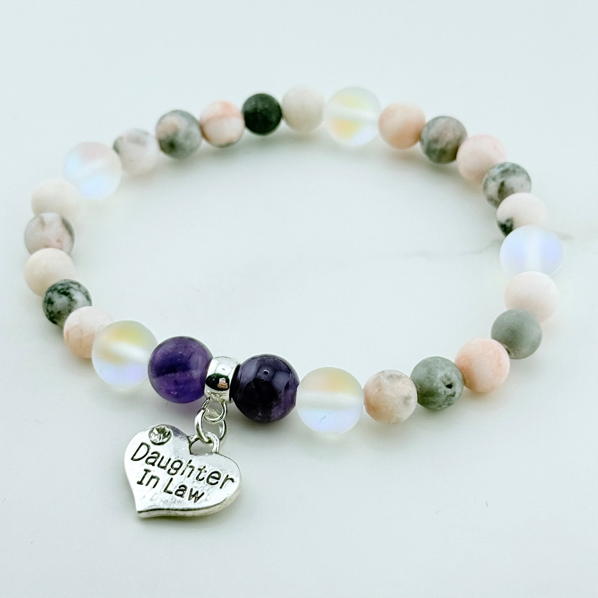 Beaded bracelet with a heart-shaped 'Daughter In Law' charm on a light background
