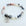 Bracelet with gray and white beads and a 'Daughter In Law' charm on a light background
