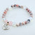 Beaded bracelet with 'Daughter In Law' charm on a white background