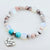Beaded bracelet with 'Daughter In Law' charm on a white background