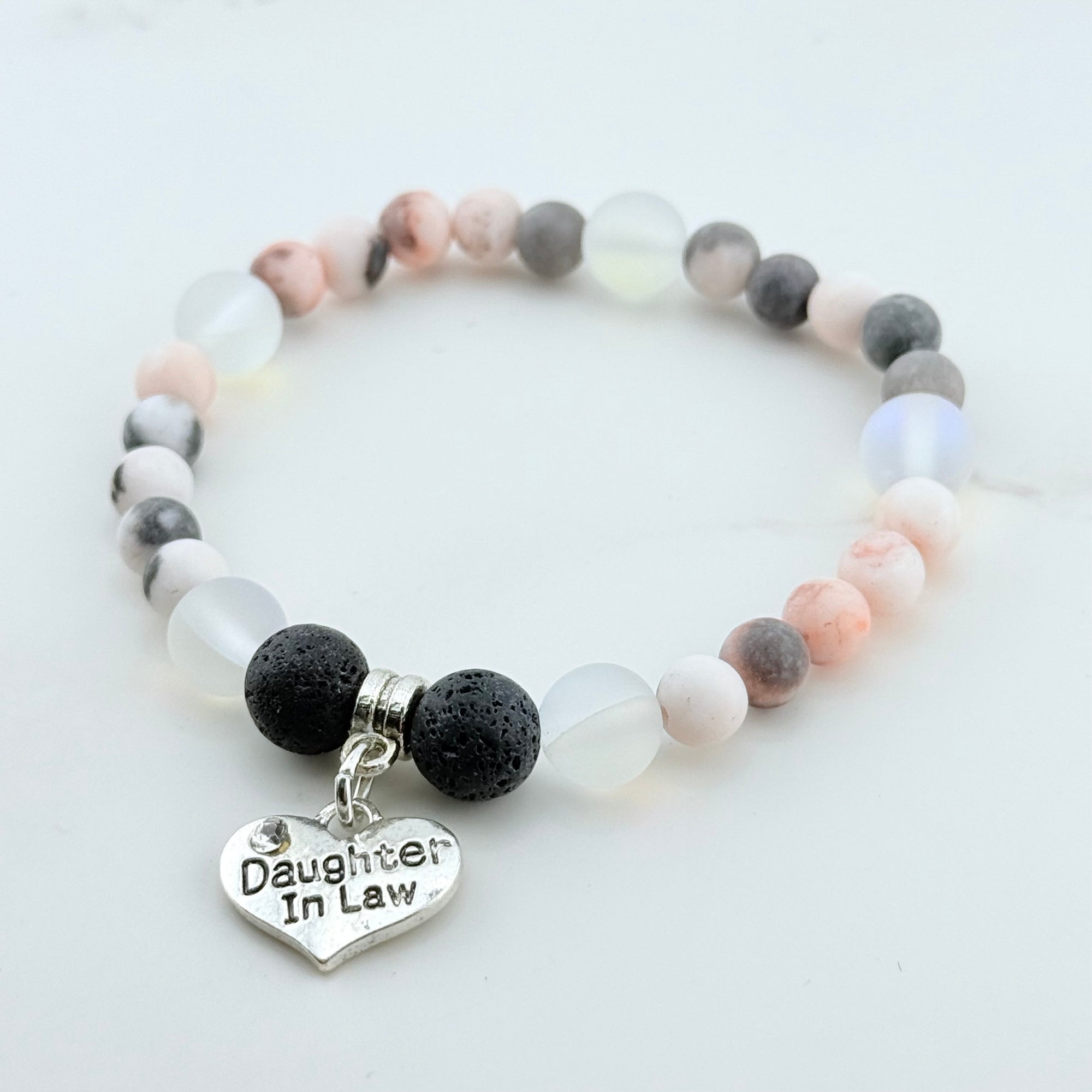 Bracelet with beads and 'Daughter In Law' charm on a light background