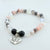Bracelet with beads and 'Daughter In Law' charm on a light background