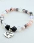 Bracelet with beads and 'Daughter In Law' charm on a light background