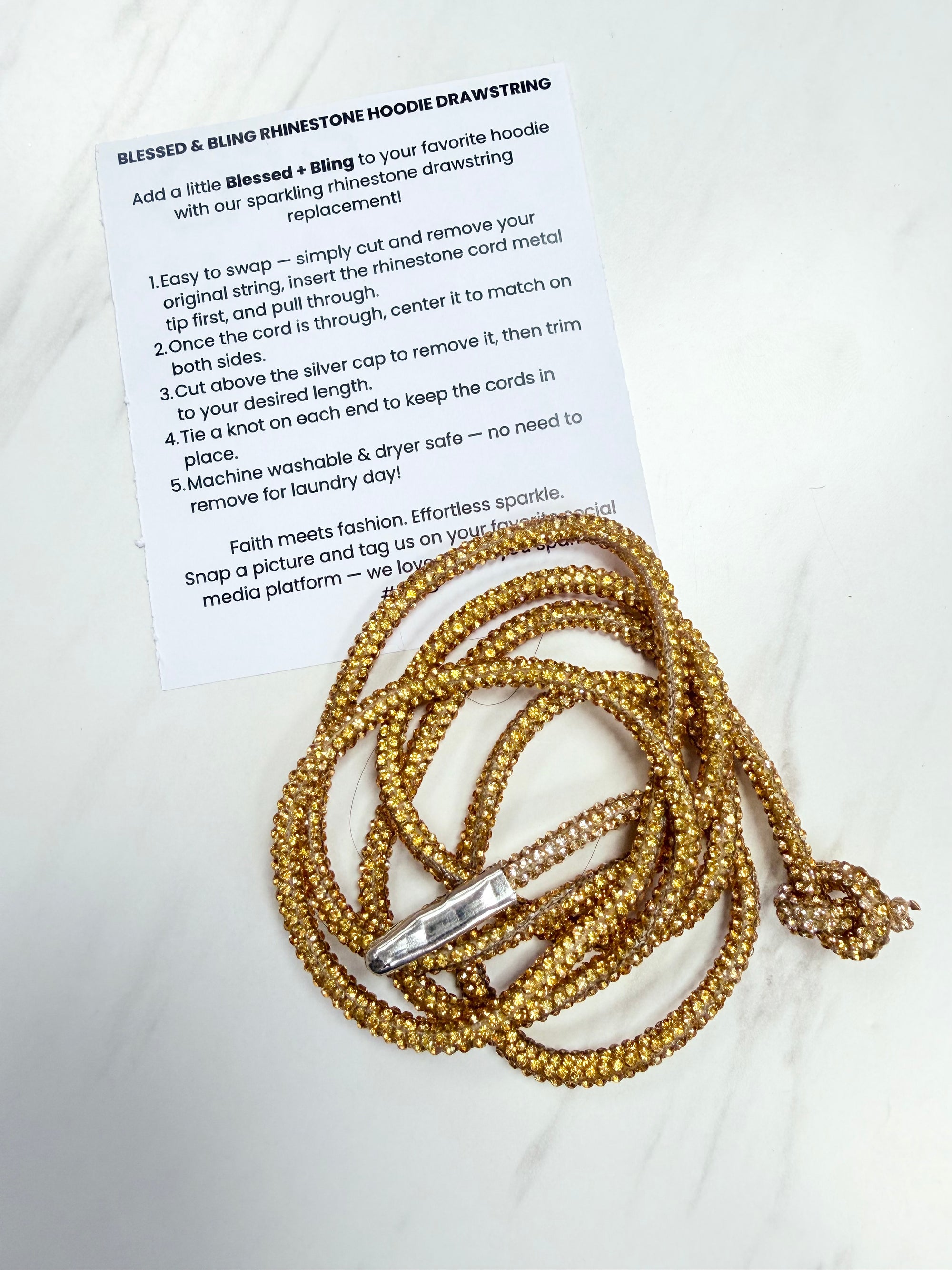 Gold drawstring with rhinestones and instructions on a white background