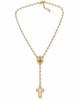 A gold lariat-style necklace featuring a beaded chain, a central medallion, and a dangling cross pendant adorned with small clear stones, shown on a plain white background.