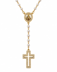 Gold and white pearl rosary necklace featuring a circular medallion with a gold figure, a drop chain with white pearls, and a gold cross adorned with small clear crystals, shown on a white background.