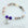 Beaded bracelet with a heart-shaped 'Grand Daughter' charm on a light background