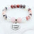 Beaded bracelet with a charm that reads 'Husband Always in my Heart' on a white background