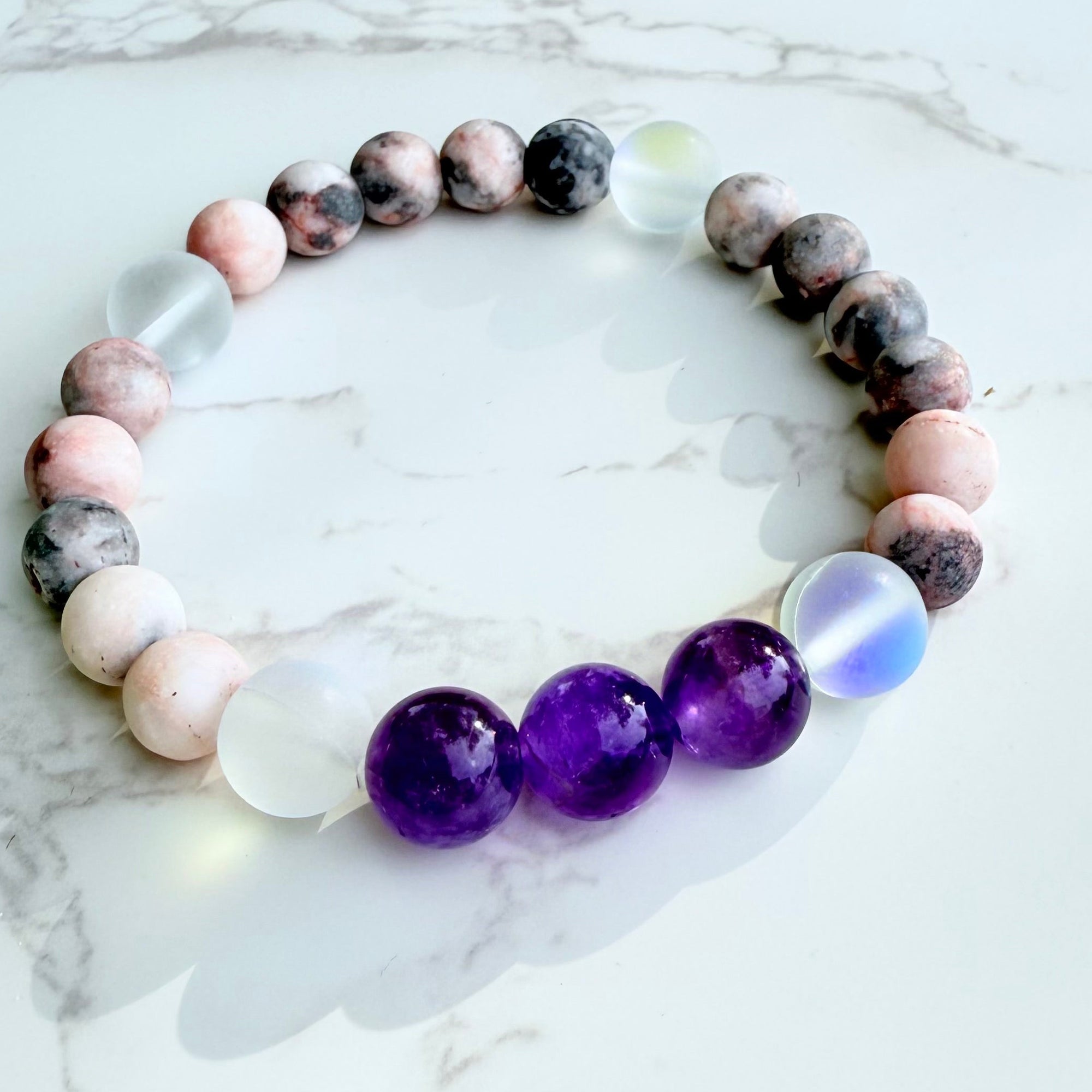 Multicolored beaded bracelet on a marble surface