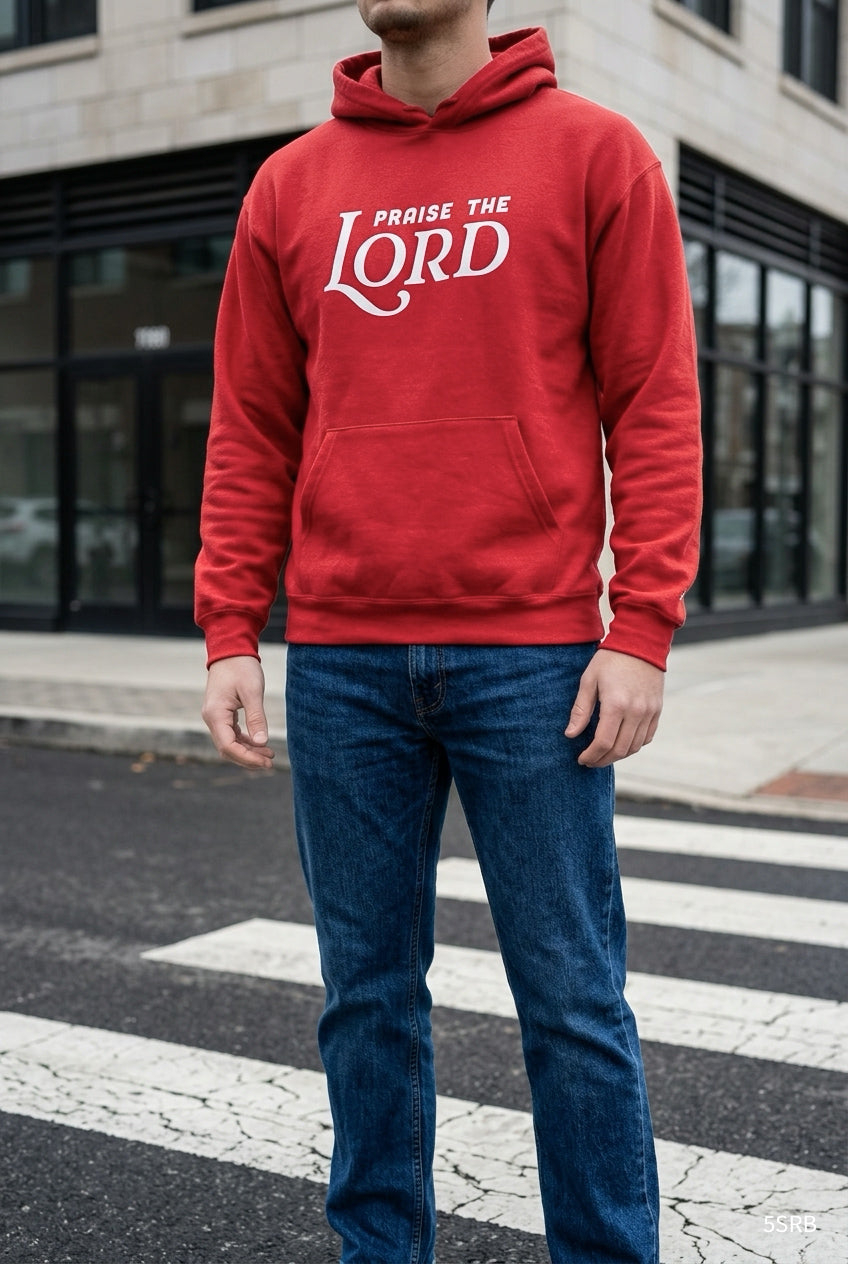 Person wearing a red hoodie with 'Praise the Lord' text on a street.