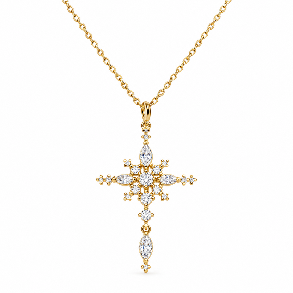 A gold cross pendant necklace adorned with clear marquise and round-cut stones, suspended from a delicate gold chain against a plain white background.