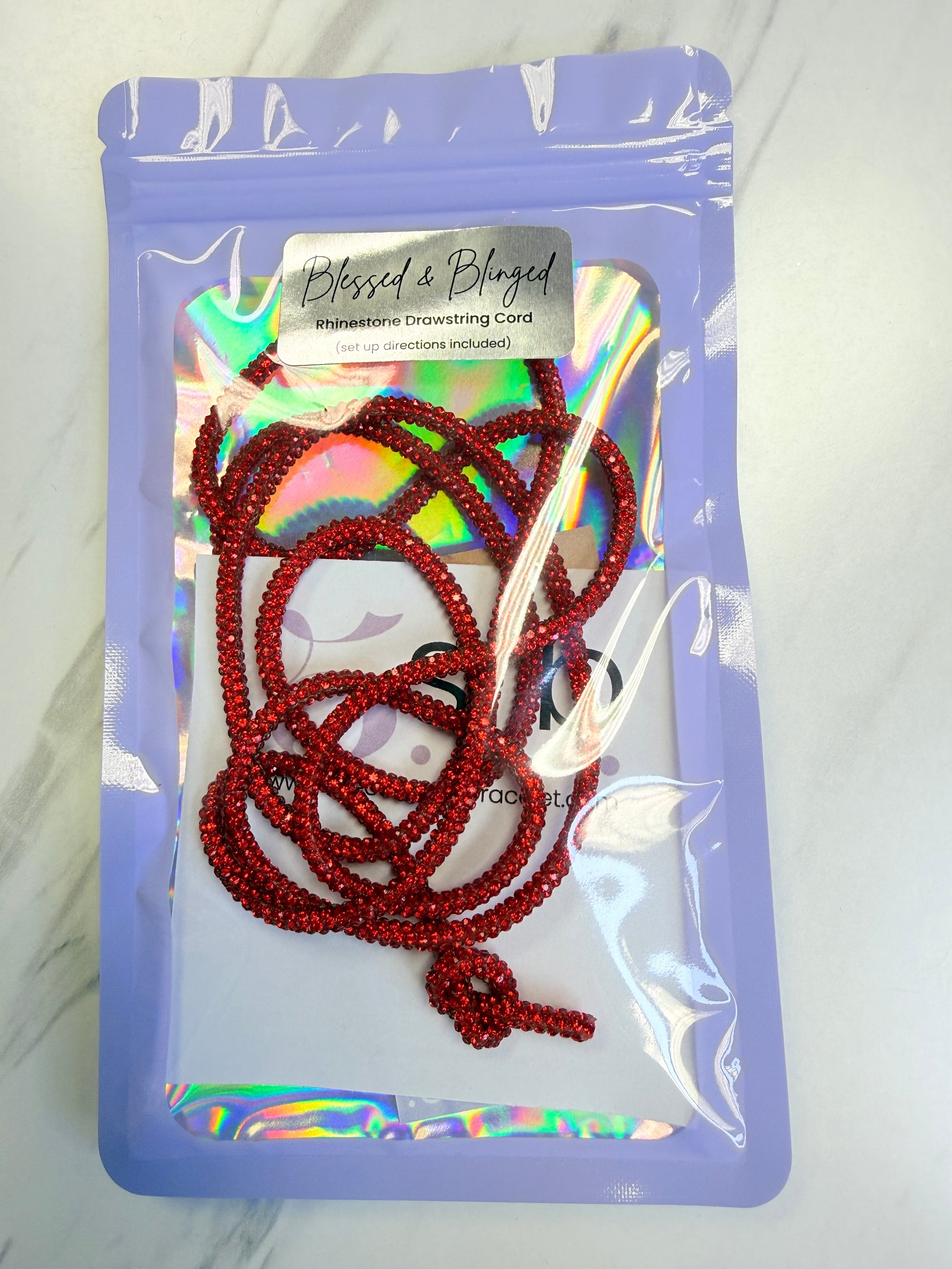 Red Rhinestone Cord on a branded card with a white background