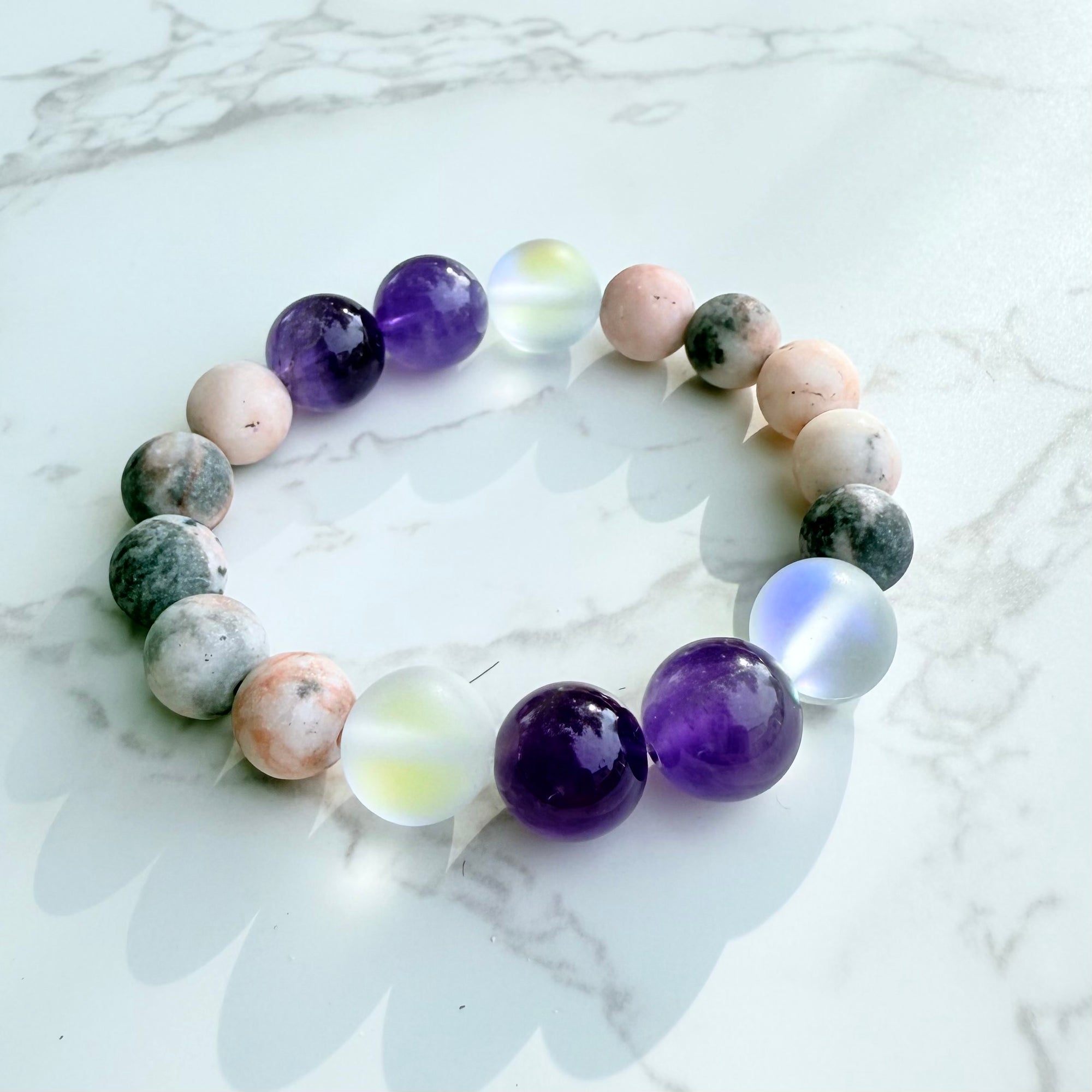 Multicolored beaded bracelet on a marble surface