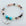 Beaded bracelet with a heart-shaped 'Aunt' charm on a light background