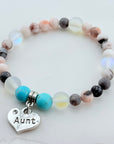 Beaded bracelet with a heart-shaped 'Aunt' charm on a light background