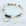 Beaded bracelet with a heart-shaped 'Sister in Law' charm on a white marble background
